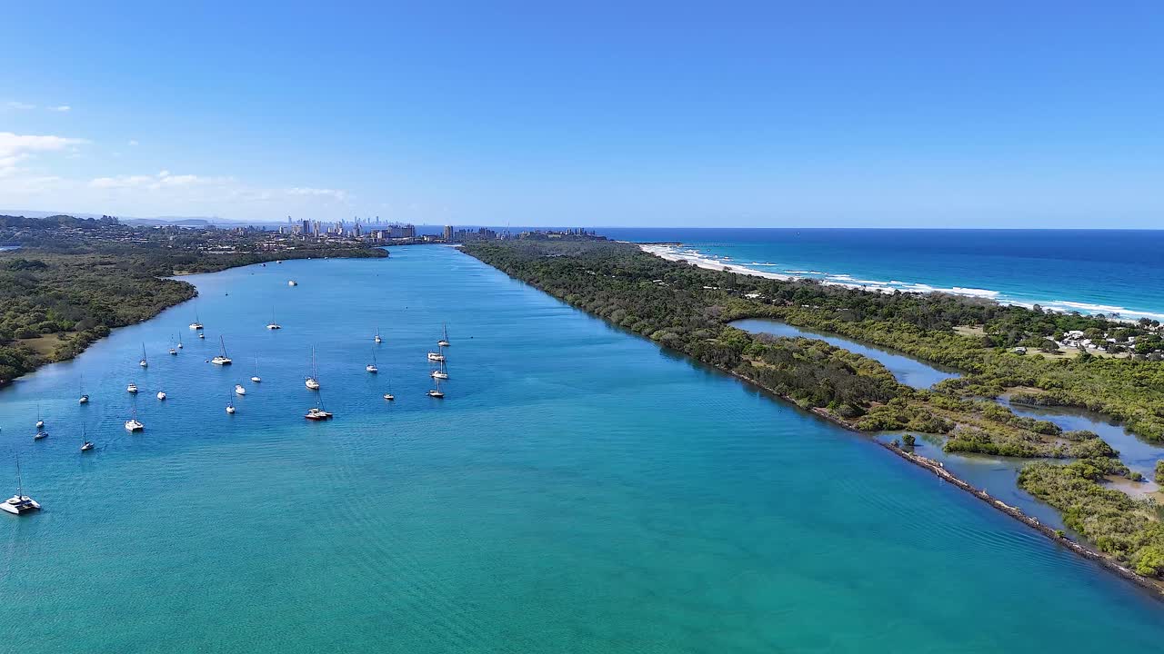 Aerial view of boats on a sunny river