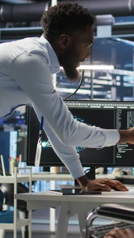 vertical video server farm supervisor and man with disability oversee ai analytics