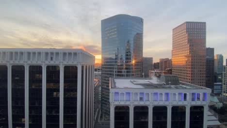 landscape view of high rise glass buildings in downtown vancouver, canada, at dusk