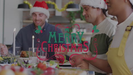 Merry Christmas text animation over people wearing Santa hats at festive dinner