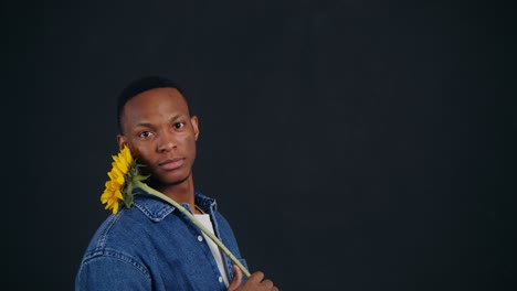 man holding a sunflower