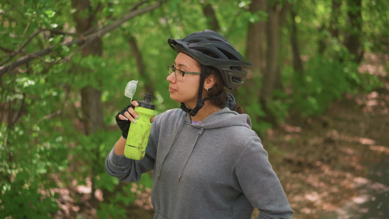 Cyclist Enjoys Nature, Biker Rests In Peaceful Woods, Riding Enthusiast Takes Calm Break Outdoors, Leisurely Cyclist Relaxes Amidst Serene Shadows Of Quiet Forest Trail During Moment Of Pause