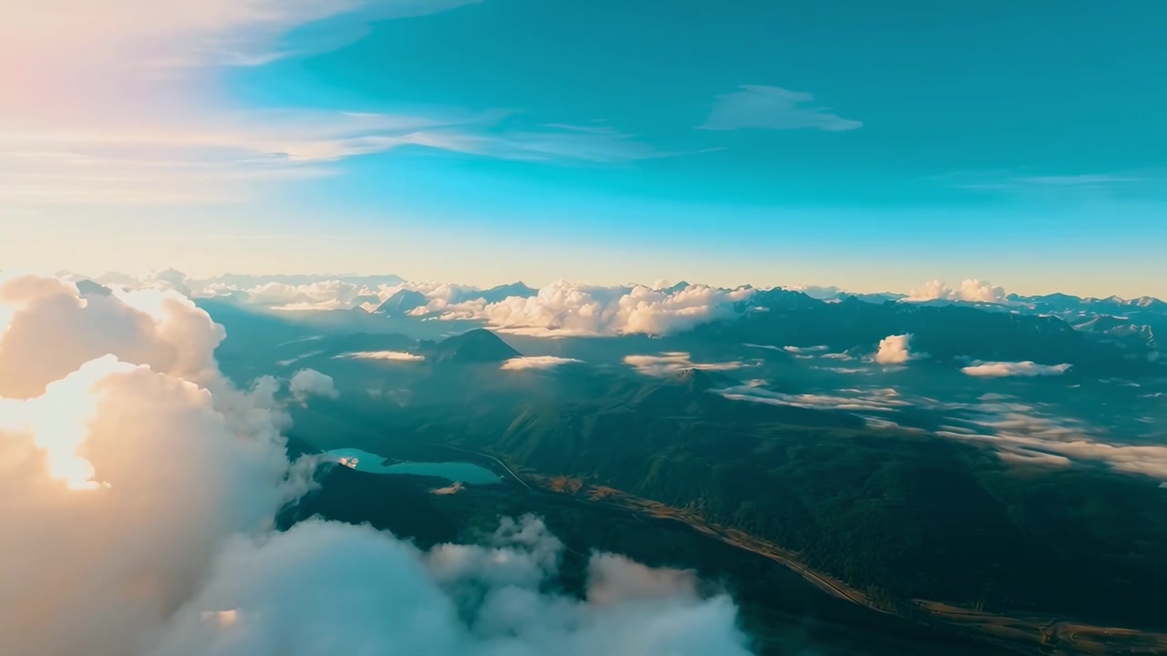 Breathtaking Aerial View of Mountains, Lake, and Clouds During Sunset