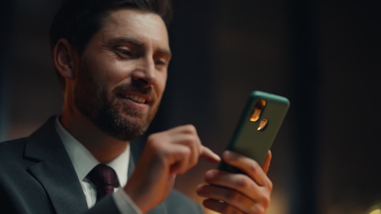 Night businessman hands touching smartphone online shopping in office closeup