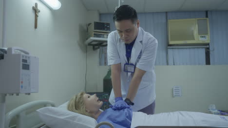 medical student performing cardiopulmonary resuscitation, cpr procedure on mannequin