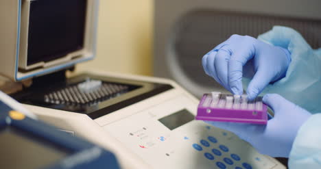 Female-Scientist-Doing-Experiment-In-Laboratory-Scientist-Holding-Test-Tube-In-Hands-1