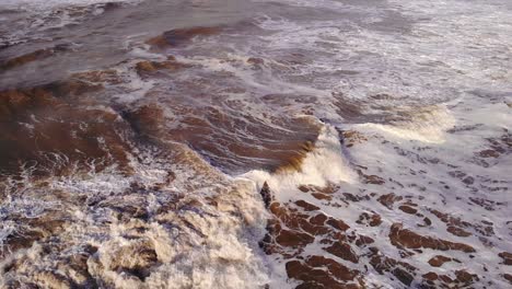 surfer hit by huge waves at the sea of katwijk aan zee in south holland, netherlands