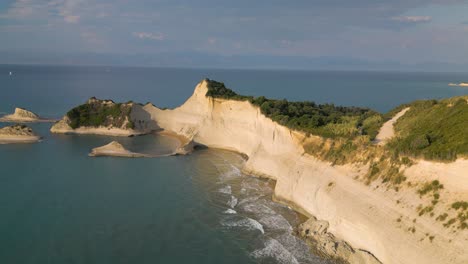 amazing establishing shot of cape drastis white cliffs - corfu, greece