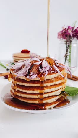 floral pancake stack with maple syrup