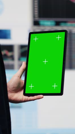 vertical video entrepreneur holds tablet with copy space screen and leveraging dashboards