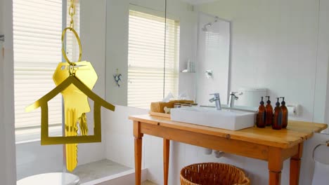 Animation-of-golden-house-and-key-over-bathroom