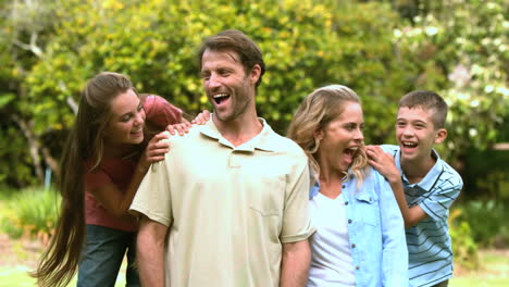 Smiling-family-spending-time-together-in-a-park