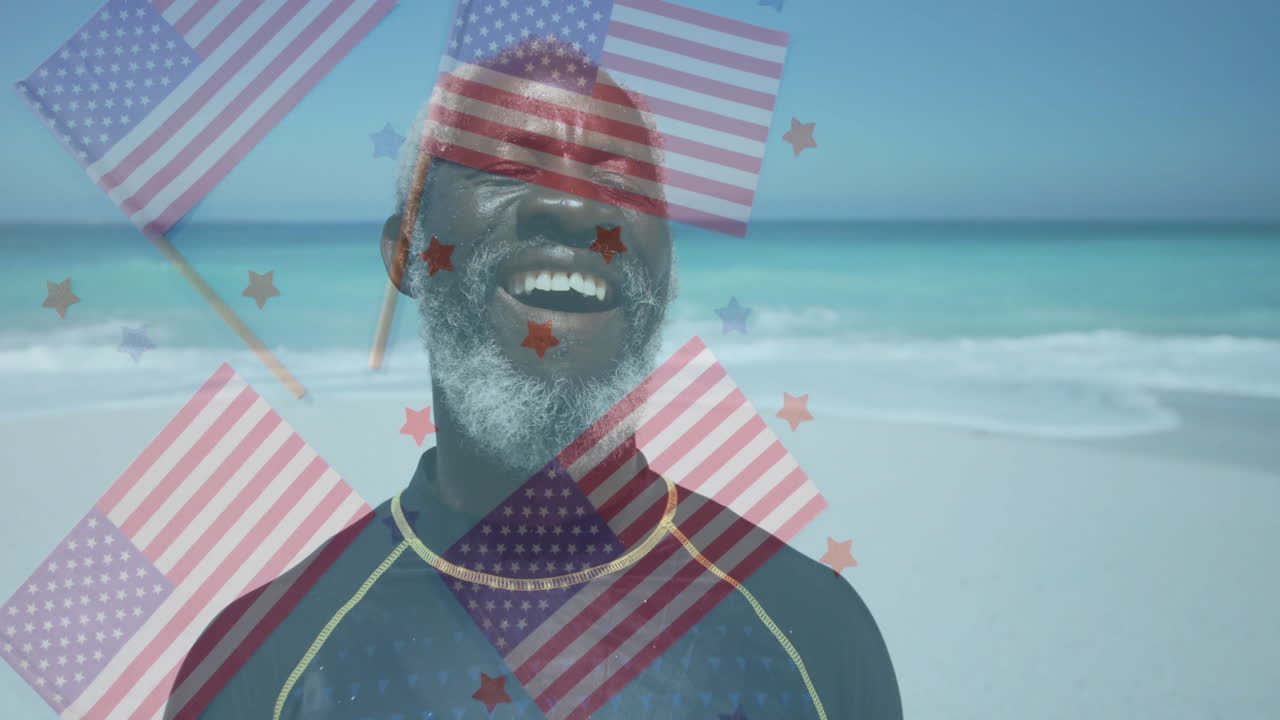 Smiling man at beach with American flags and stars overlay animation
