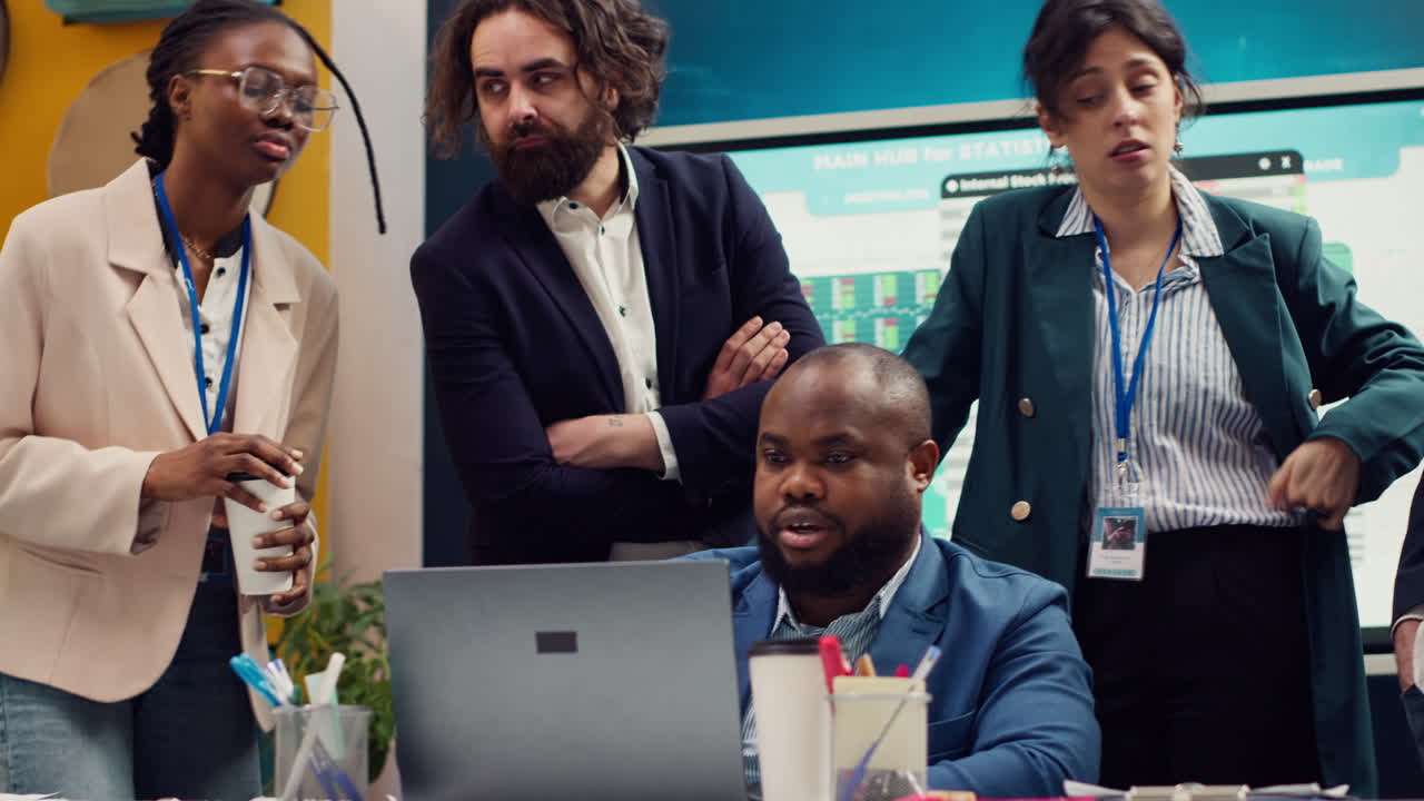 Sales team reviewing market trends and statistics in a boardroom