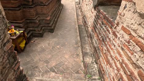 statue of buddha ascending ancient temple stairs