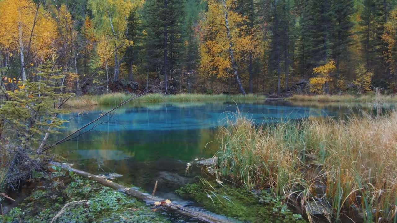 Panorama of Blue Geyser lake in Altai mountains in rainy day