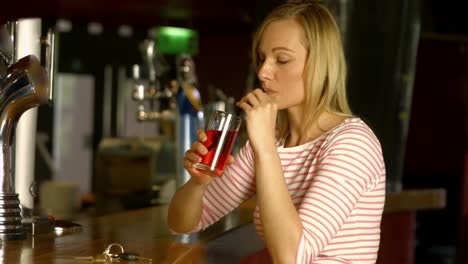 woman laughing at the bar