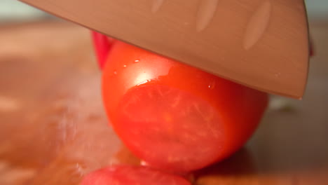 knife cuts vegetables for salad in slow motion