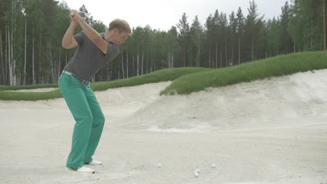 golfer hitting a sand shot