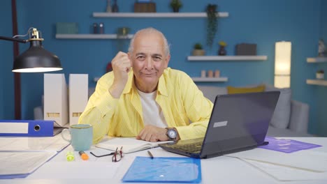Home-office-worker-old-man-expressing-his-mind-and-success-to-the-camera.