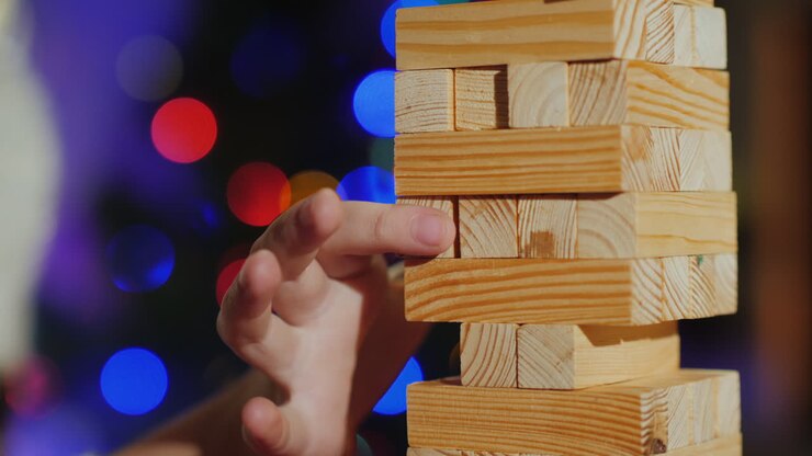 Pulling A Wooden Block Out Of The Tower Is A Game For Training Accuracy Close-Up Shot