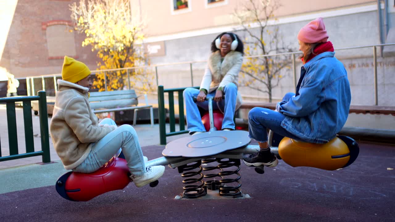 Friends Enjoying a Seesaw Ride at the Playground
