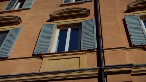 Italian Building Facade with Windows and Shutters
