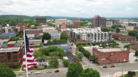 Huntsville,-Alabama-skyline-with-drone-video-still-with-American-flag-flying