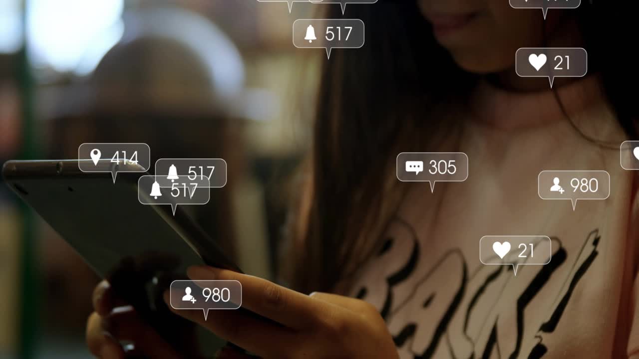 Woman tapping tablet in cafe, tracking social media icons emerging and fluctuating around device