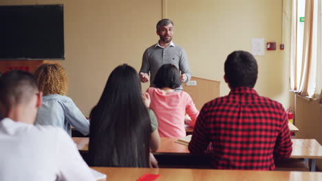 teacher lecturing students in a classroom