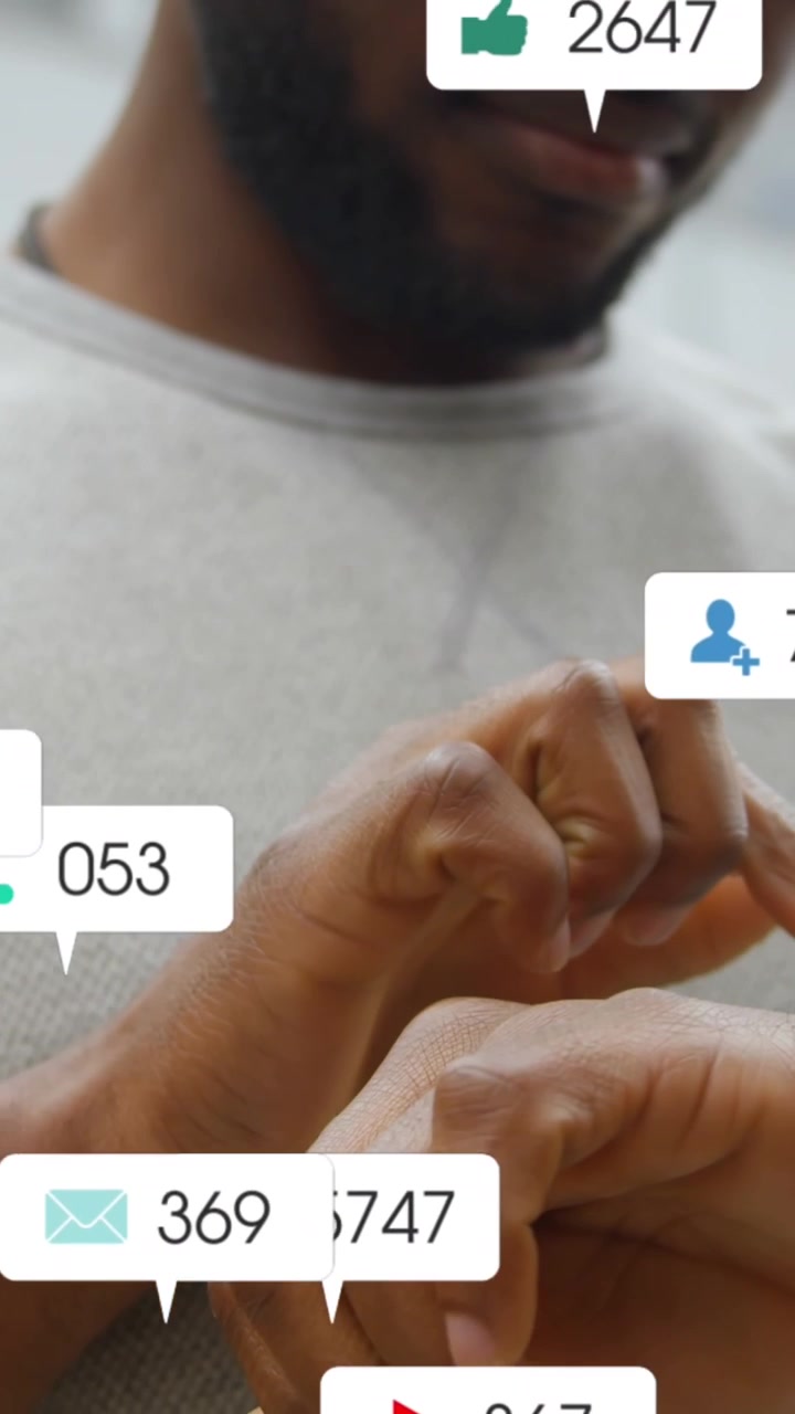 Animation of social media icons falling over mid section of a man using smartwatch outdoors