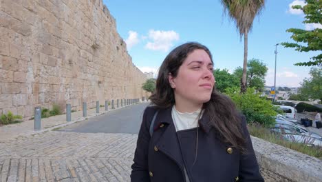 woman walking near the old city wall
