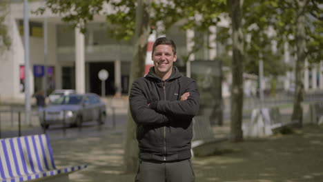 handsome man in sportswear smiling at camera