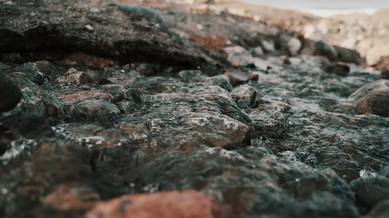 Ice water flows thru rocks at point 660, just outside Kangerlussuaq