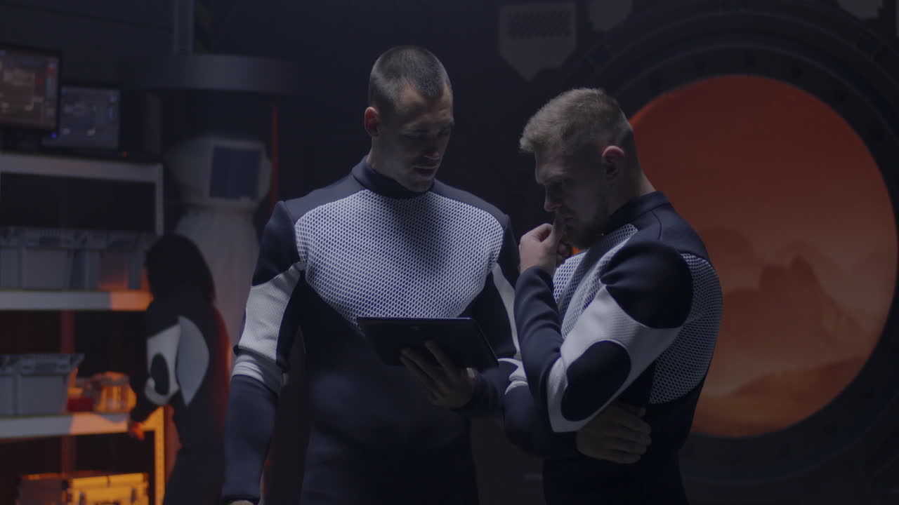 Two Astronauts Working Together in a Space Station Laboratory