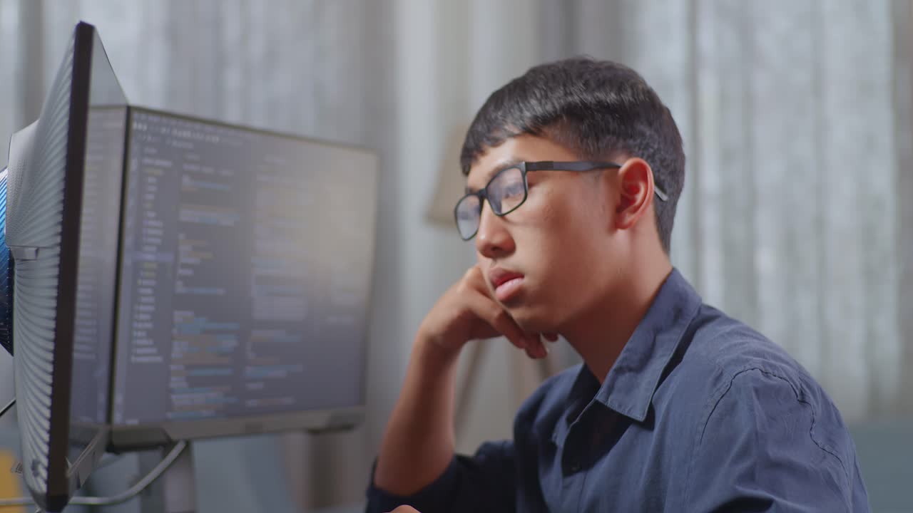 Young Programmer Working on Computer