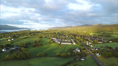Kenmare-Town-in-Beautiful-County-Kerry,-Ireland-at-Sunset---Aerial-Landscape