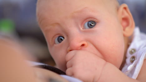 baby with hand in the mouth