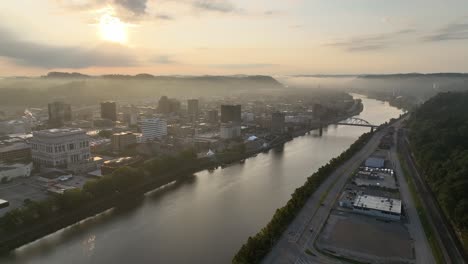 high aerial push over charleston west virginia at sunrise