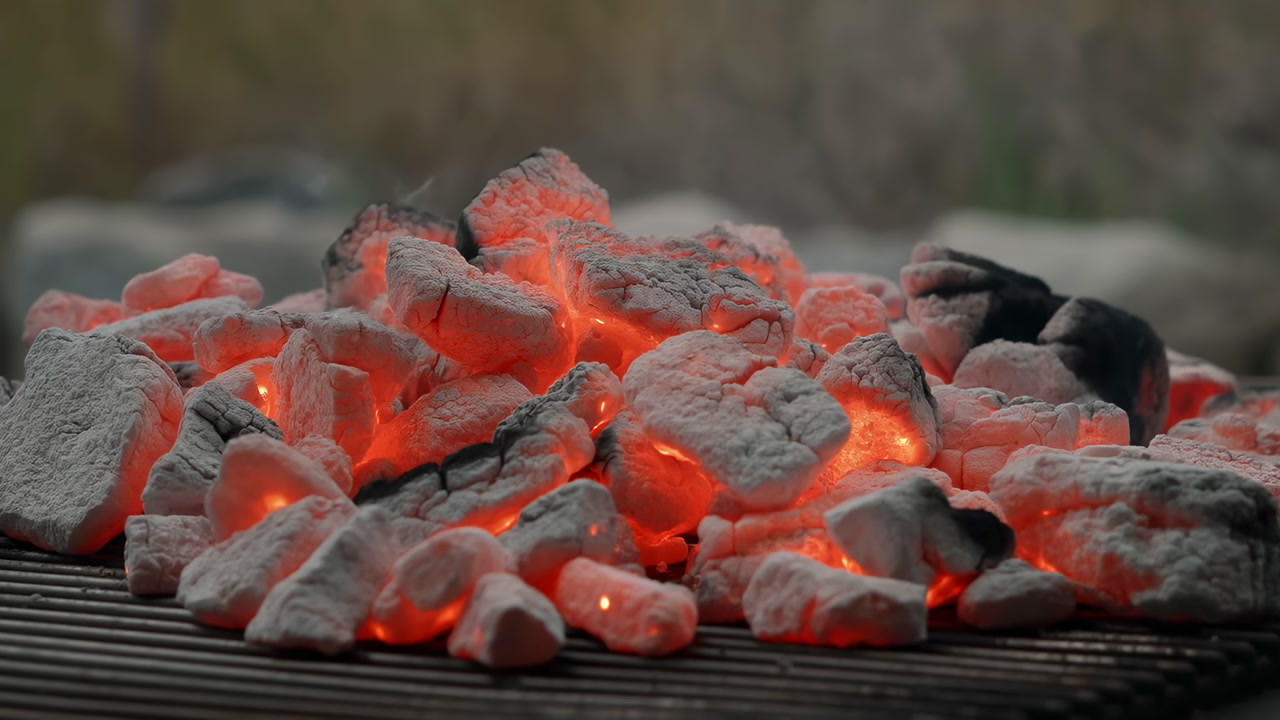 Glowing Hot Charcoal On Backyard Grill, Redorange Embers And Ashcovered Briquettes Radiating Heat, Closeup