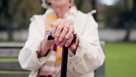 Walking-stick,-hands-and-senior-woman-closeup
