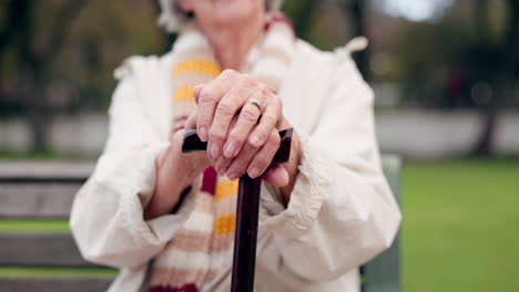 walking stick, hands and senior woman closeup