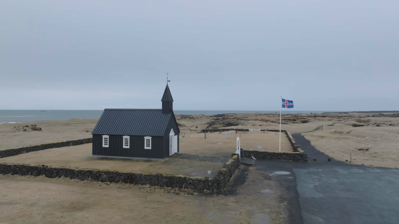 Aerial View of B&uacute;&eth;akirkja Black Church, Landmark of Iceland, Exterior and National Flag
