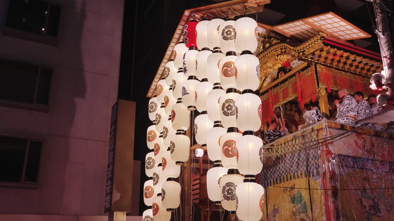 Illuminated Japanese Festival Float with Lanterns at Night