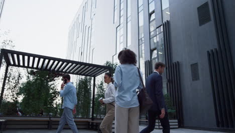 Office-girl-working-tablet-computer-standing-outdoors-at-lively-downtown-area.