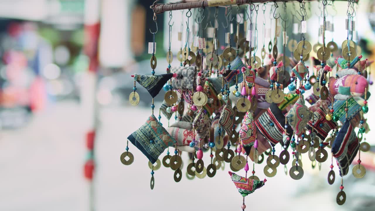 Handheld view of handmade Vietnamese decorations at the market
