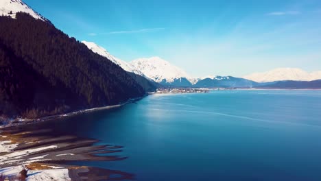 4K-Drone-Video-of-Seward,-Alaska-Beach-and-Surrounding-Snow-Covered-Mountains-on-Snowy-Winter-Day