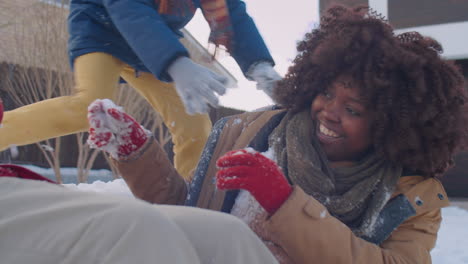 parents and little son playing snowballs and having fun outside