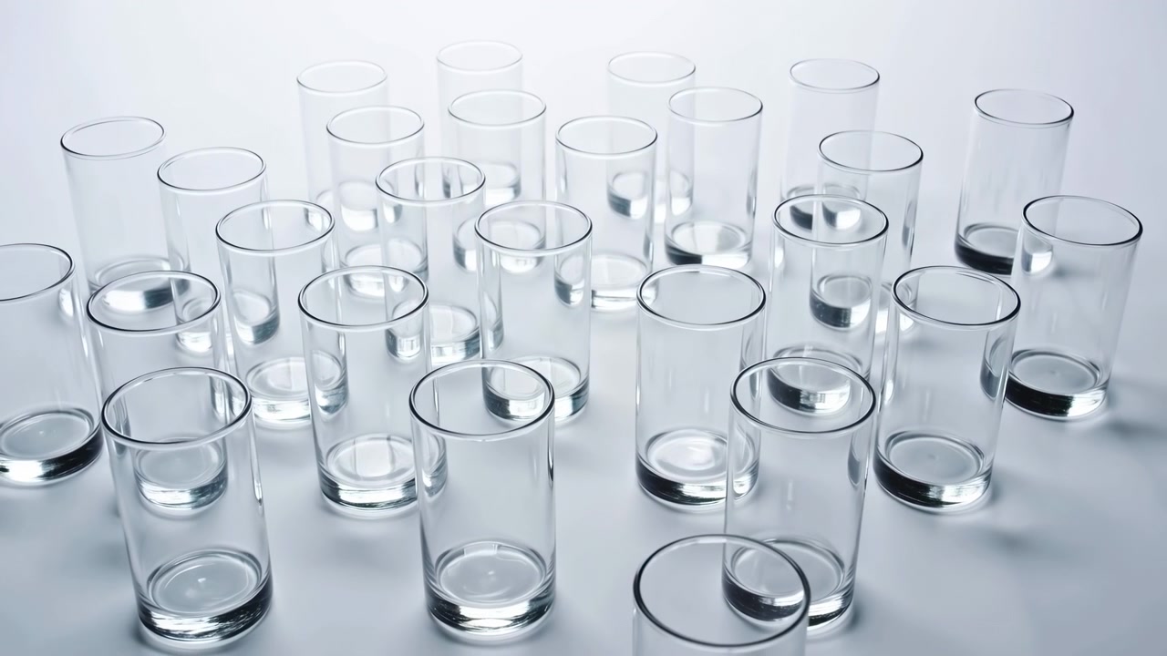Scientific test tubes arranged in a laboratory setting with a neutral mood and top-down viewpoint, featuring clear and white materials, chemical analysis and research applications.