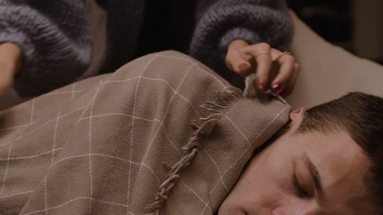 Couple snuggling in bed at night
